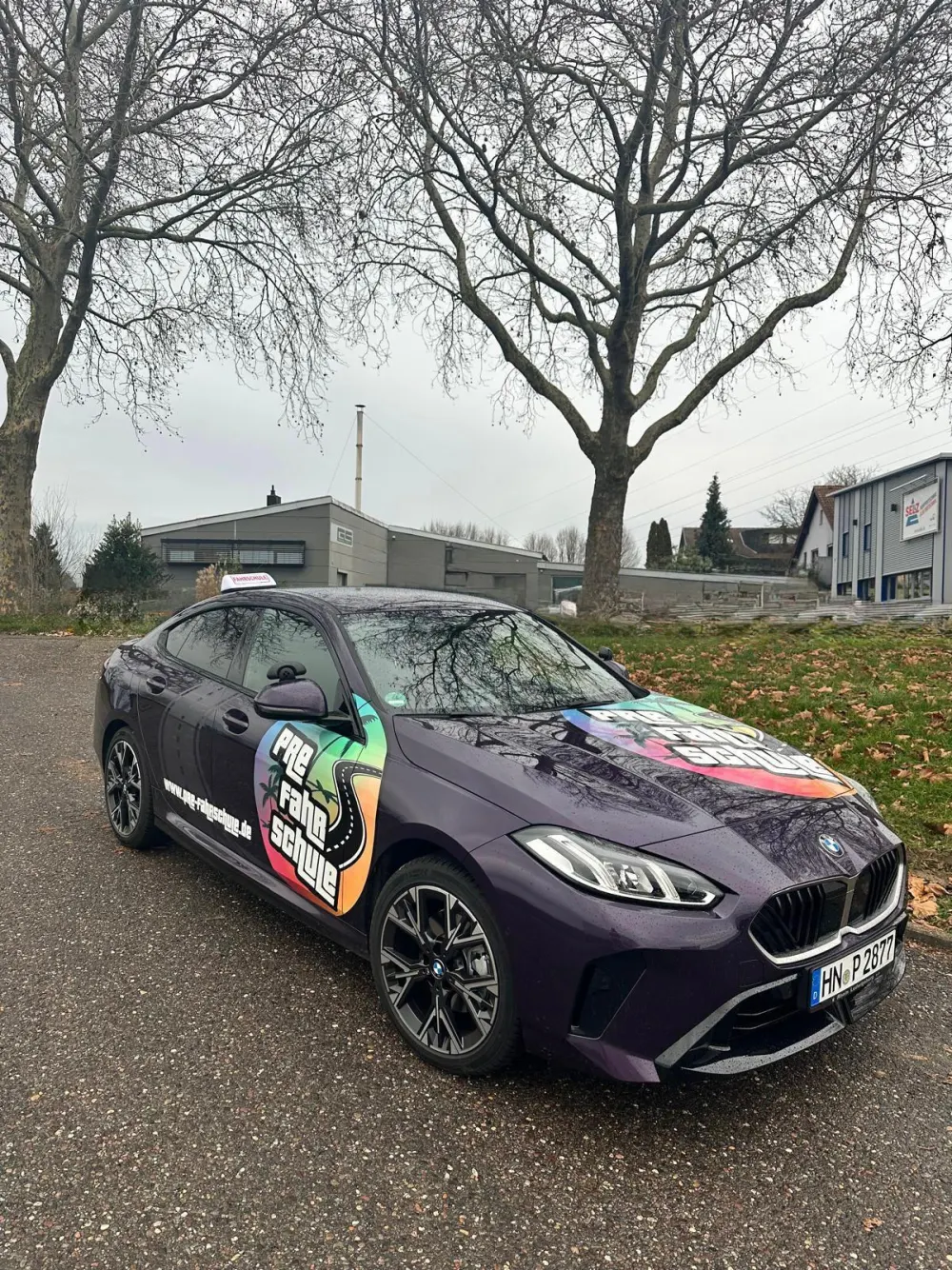 BMW in PRE design on a street in Heilbronn, driving school car